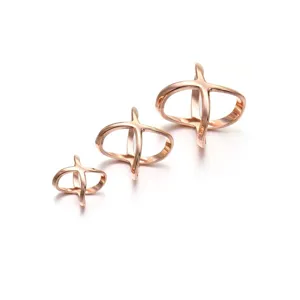 Rose gold X-shaped metal scarf buckle and waist cincher set, stylish clothing accessory.