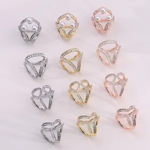 Detailed view of elegant multi-style rhinestone pearl scarf buckles and hijab clips.
