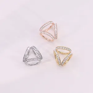 Detailed view of multi-style rhinestone three-ring scarf buckles in silver, gold, and rose gold.