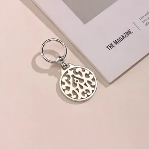 Silver metal hollow circular scarf buckle bag pendant, exquisite retro floral pattern accessory.