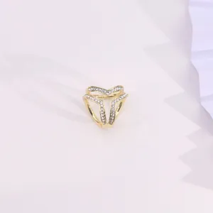 Closeup view of the elegant gold rhinestone three-ring scarf buckle detail accessory.