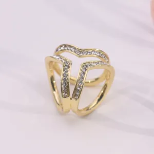 Detailed view of the elegant gold-toned multi-ring rhinestone scarf buckle close-up.