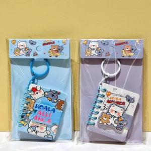 Detailed view of cute cartoon koala bear mini spiral notebook keychain set in two colors.