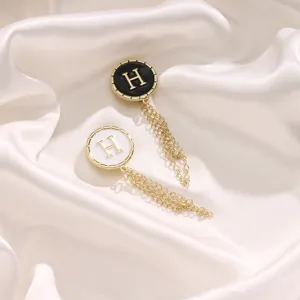 Magnetic pant leg shortening clip with chain, metal H letter decorative fashion accessory.