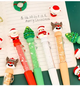 Cute Christmas gel pens with silicone cartoon toppers and sparkling rhinestones inside clear barrels.