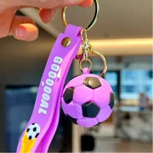 Cartoon PVC simulation soccer football keychain pendant detail view, purple and black design.