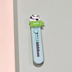 Detailed view of cute mini panda utility knife, resin box cutter with portable retractable blade.