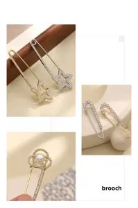 Primo piano dettagli di spilla di sicurezza con strass, design stella e perla, accessorio.