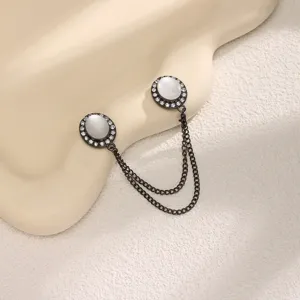 Magnetic pants cuff clip set with faux cat's eye stone and double chain detail.