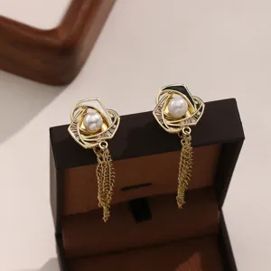 Elegant magnetic trouser cuff clips with pearls and chains for stylish clothing adjustment.