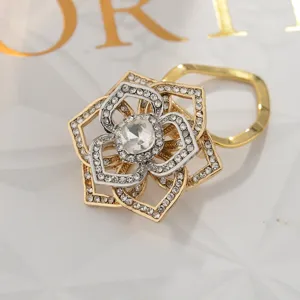 Detail shot of exquisite multi-layer rhinestone flower brooch scarf clip in dual-tone finish.