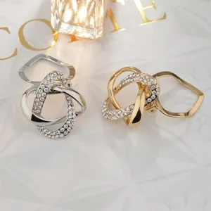 Detail shot of rhinestone alloy scarf clips, versatile brooch and clothing corner clips in pairs.