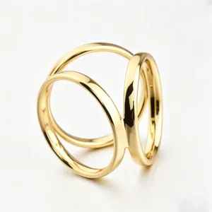Gold tone triple ring scarf buckle detail view, elegant metal brooch clip accessory for women.