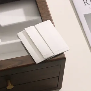 Ultra-thin invisible double-sided clothing tape for anti-slip neckline and secure dress wear.