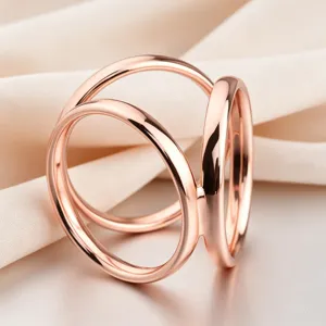 Elegant rose gold triple ring scarf clip, modern geometric design for women detail view.