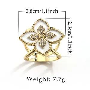 Gold four leaf clover scarf ring brooch with white enamel inlay and sparkling crystal rhinestones.