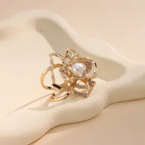 Elegant hollow floral scarf ring with pearl and rhinestones detailed close-up shot.