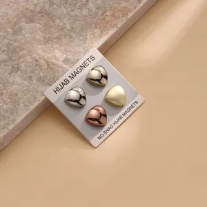 Detail view of triangle hijab magnets set, strong magnetic closure for scarves and cuffs.