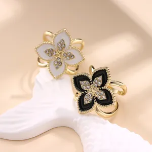 Chic black and white clover scarf ring set with sparkling rhinestones for women elegant.