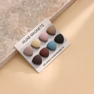 Close-up of triangular hijab magnets set on a card, showing multi-color anti-slip magnetic pins.