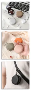 Round PU leather earphone storage bag portable mini coin purse keychain with mirror and zipper.