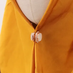 Detail view of elegant oval cat's eye rhinestone magnetic hijab pin for women fashion.