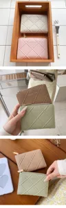 Detailed close-up view of women quilted short zipper wallet, lifestyle staging and holding.