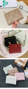 Detailed shot of simple waffle pattern quilted zip fold women wallet in multiple chic colors.