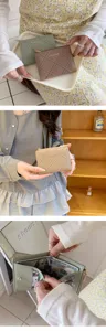 Stylish women's bi-fold wallet with waffle quilted texture, zipper pocket and card slots.