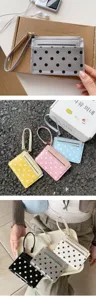 Detailed view of cute patent leather polka dot card holder with wrist strap and multiple card slots.
