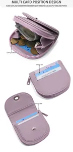 Portafoglio mini in pelle viola con tasca portamonete con zip, scomparti per carte e chiusura.