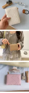 Korean style solid color quilted bifold zipper wallet for women, compact and fashionable daily use.