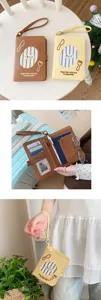 Detail view of cute dachshund leather passport holder with card slots and wrist strap.