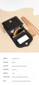 Detailed view of the black PU leather mini crossbody bag with gold chain and built-in mirror.