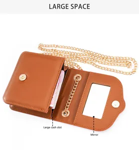 Stylish brown leather mini crossbody bag with metal chain strap, card slot and built-in mirror.