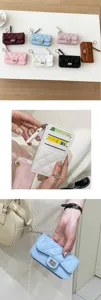 Women's quilted PU leather card holder coin purse with zipper and matching keychain.