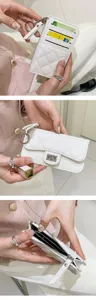 Detail view of a quilted PU leather card holder wallet for women with zipper and keychain.