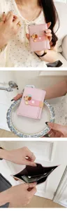 Pink trifold wallet for women with cute cartoon dachshund closure and spacious card slots.