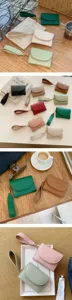 Minimalistisches Damen-Geldbörse Detail mit verschiedenen Farben und schickem Handschlaufe.