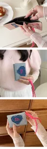 Chic denim tri-fold coin purse with pink heart patch and cute lanyard for daily use.