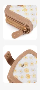 Daisy print women wallet compact card holder detail view showing zipper and snap button.