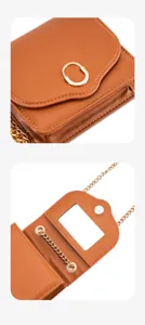 Brown leather mini crossbody bag detail view with gold chain strap and metal clasp mirror.