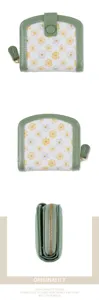 Detailed view of women's floral folding wallet, showing daisy print, zipper and snap closure.