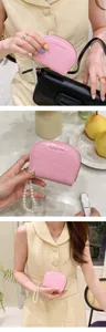 Pink crocodile pattern coin purse detail with elegant pearl wrist strap for women card holder.