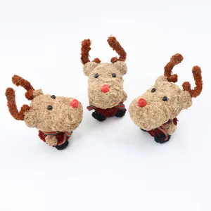 Detail shot of three cute moss reindeer figurines with red noses for Christmas DIY crafts.