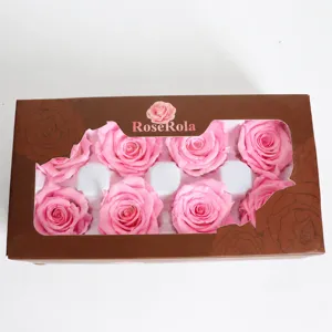 Detailed view of preserved pink rose heads in a window gift box, ideal for DIY floral decor.