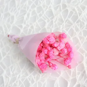 Mini preserved baby's breath flower bouquet wrapped in pink paper for sweet gifts.