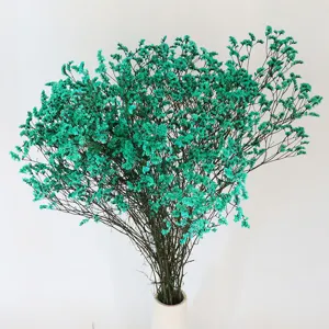 Dried crystal grass bouquet, vibrant turquoise floral decor for home living room display.
