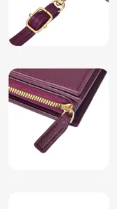 Weinrote Leder Handytasche Umhängetasche Detailansicht mit goldener Hardware und Reißverschluss.