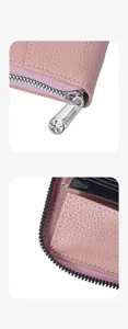 Detailansicht des rosa Leder-Akkordeon-Kartenetuis mit glattem Metallreißverschluss.